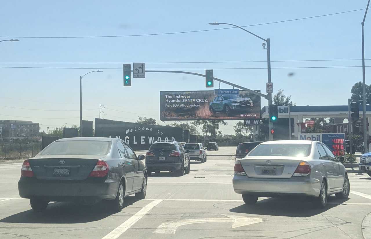 Billboard ad extending right above the street